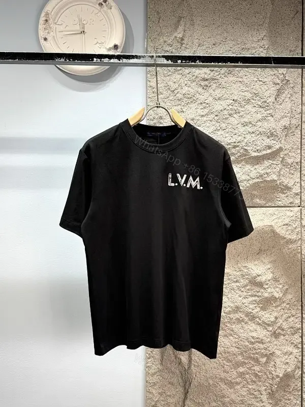 View 1 of Minimalist Black Cotton Tee with Subtle LV.M Logo