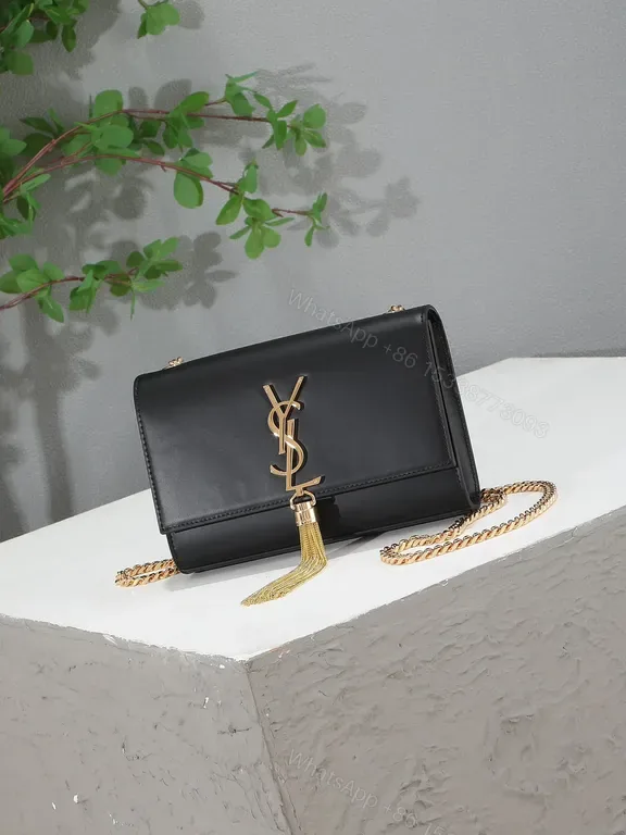 View 1 of Chic Black Leather Flap Bag: Gold-YSL Monogram, Versatile Luxury
