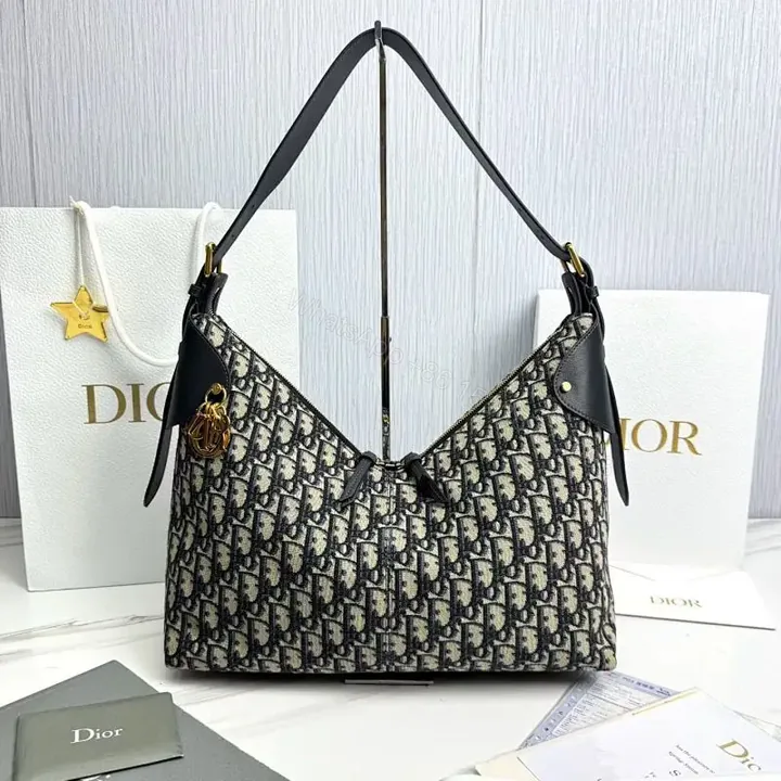 View 1 of Chic Monogram Shoulder Bag: Elegant & Versatile Satchel