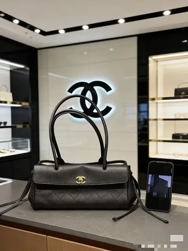 View 1 of Quilted Black Leather Handbag with Gold Hardware Luxury