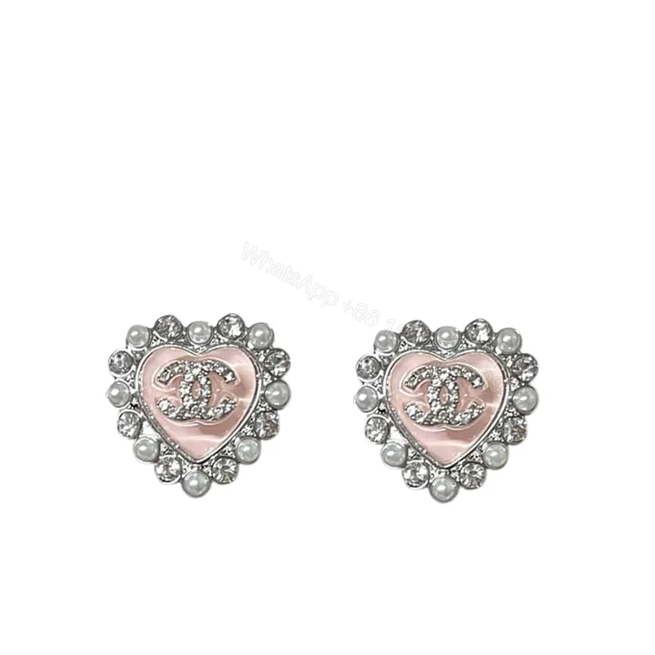 View 1 of CHANEL HEART MOTIF AND CRYSTAL EARRINGS IN PINK