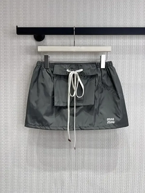 View 1 of Gray Nylon Mini Skirt Drawstring Waist Miu Miu Style Front Patch Pocket Skirt
