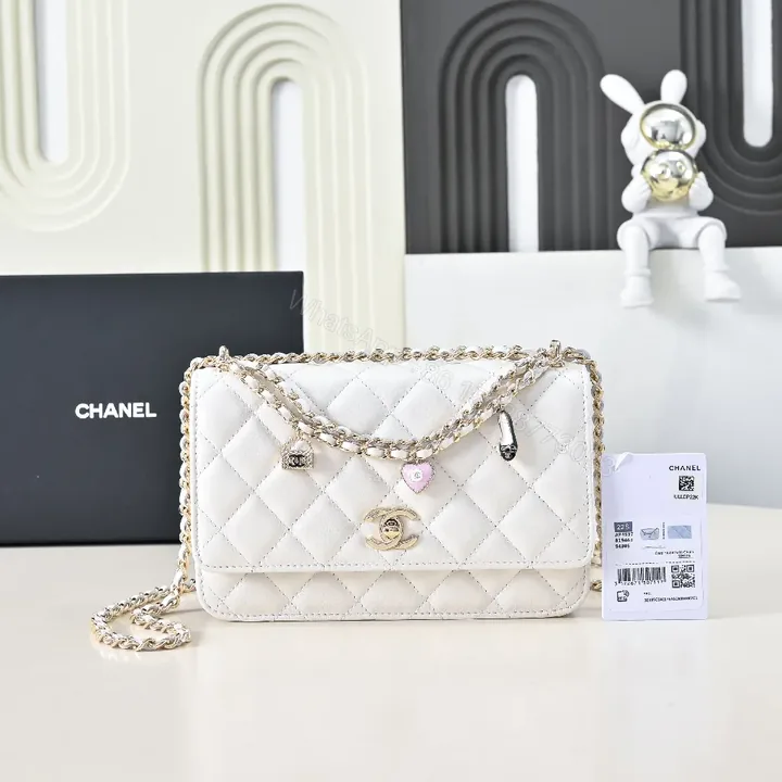 View 1 of Quilted Mini Bag: White Calfskin, Gold Chain, Luxe Silhouette