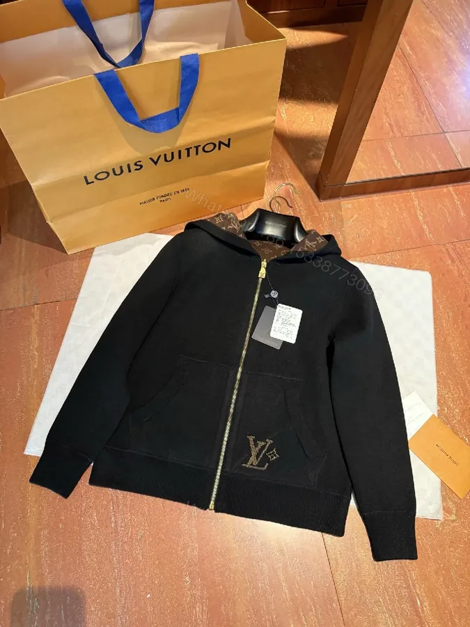 View 1 of Black Zip Hoodie: Monogram Detail, Premium Cotton Blend, Versatile Luxury