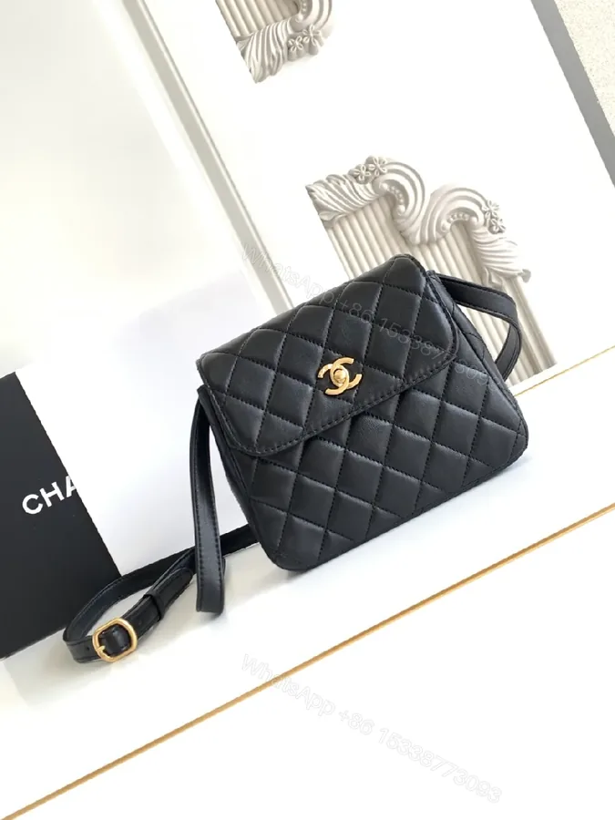 View 1 of Compact Black Quilted Bag with Gold Hardware