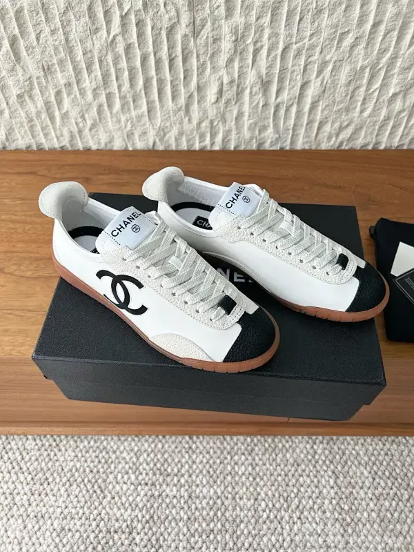 View 1 of Chic Monochrome Leather-Accent Luxury Sneaker, Low-Top