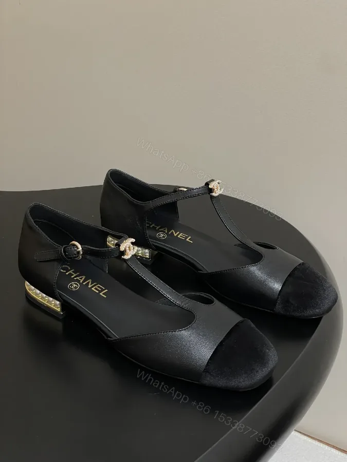 View 1 of Chic Black Suede T-Strap Pumps with Pearl Clasp