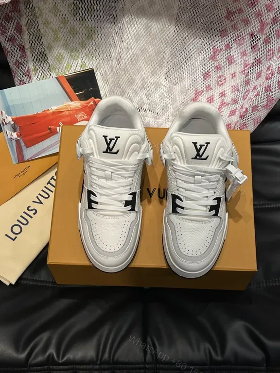 View 1 of White Leather High-Top Sneakers with LV Branding and Visible Hardware