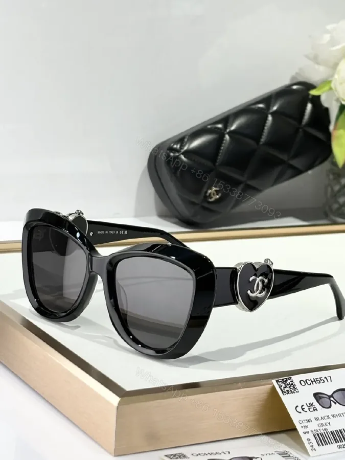 View 1 of Oversized Black Cat-Eye Sunglasses with Subtle Logo Details