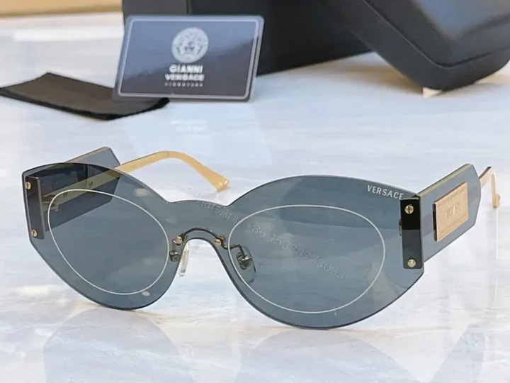 View 1 of Sculpted Round Sunglasses: Bold Hardware Luxe Eyewear