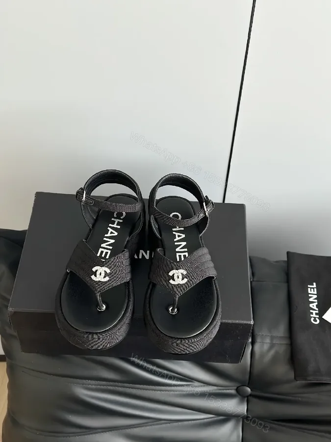 View 1 of Lux Black Sandals • Textured Upper • Logo Strap Luxe Comfort