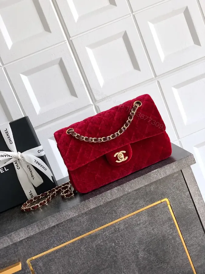 View 1 of Rich Velvet Red Flap Bag with Gold Chain Embellishment