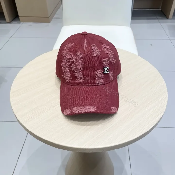 View 1 of Distressed Burgundy Cap: Luxe Texture, Subtle Logo, Everyday Wear