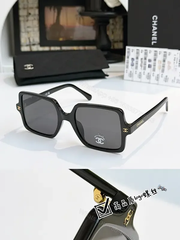 View 1 of Black Frame Oversized Sunglasses with Gold Chanel Logos, Matte Gray Lenses