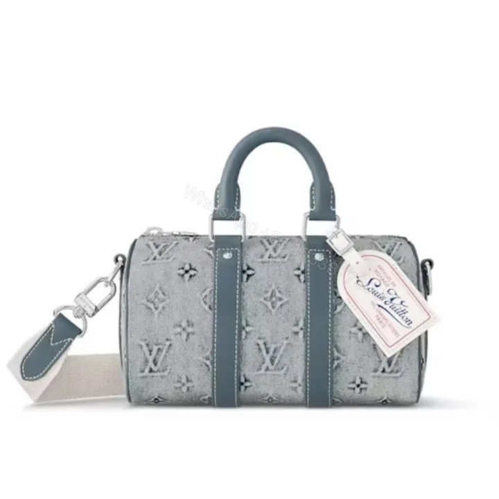 View 1 of Louis Vuitton Keepall Bandoulière 25 Monogram Washed Denim Canvas 24Cm M22762