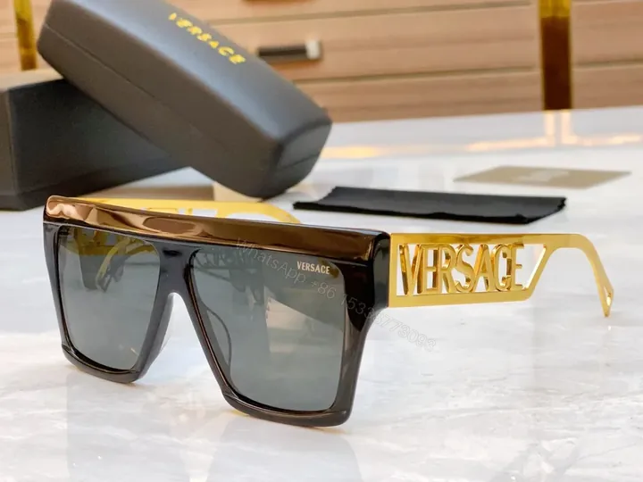 View 1 of Bold Black & Gold Luxe Sunglasses - Statement Frame, All-Day Comfort