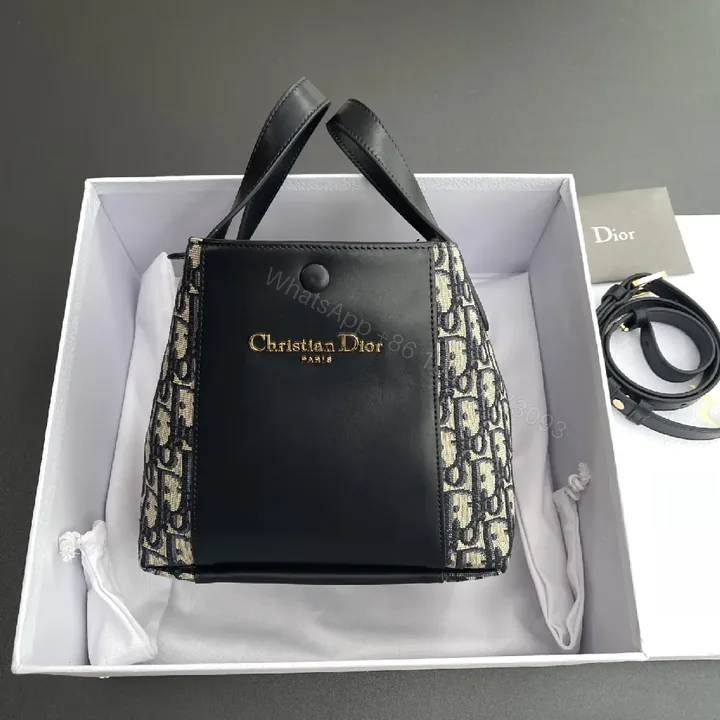View 1 of Black Leather Mini Crossbody: Signature Monogram Compact Bag