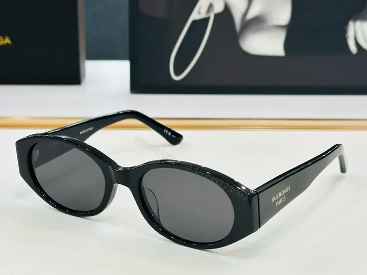 View 1 of Chic Black Acetate Cat-Eye Sunglasses: Luxury Comfort