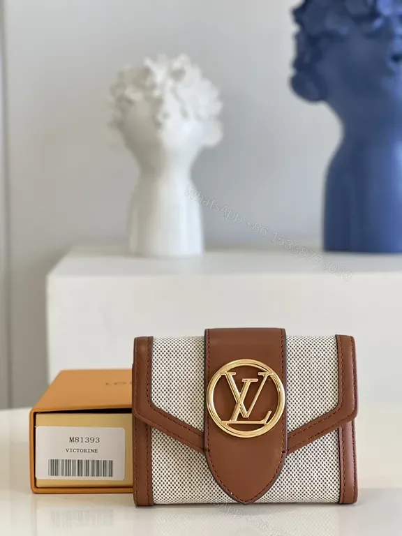 View 1 of Iconic Victorine Wallet: Compact Luxury Canvas & Leather Trim