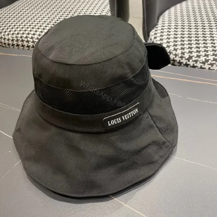 View 1 of Minimalist Black Bucket Hat with Discreet Luxe Label