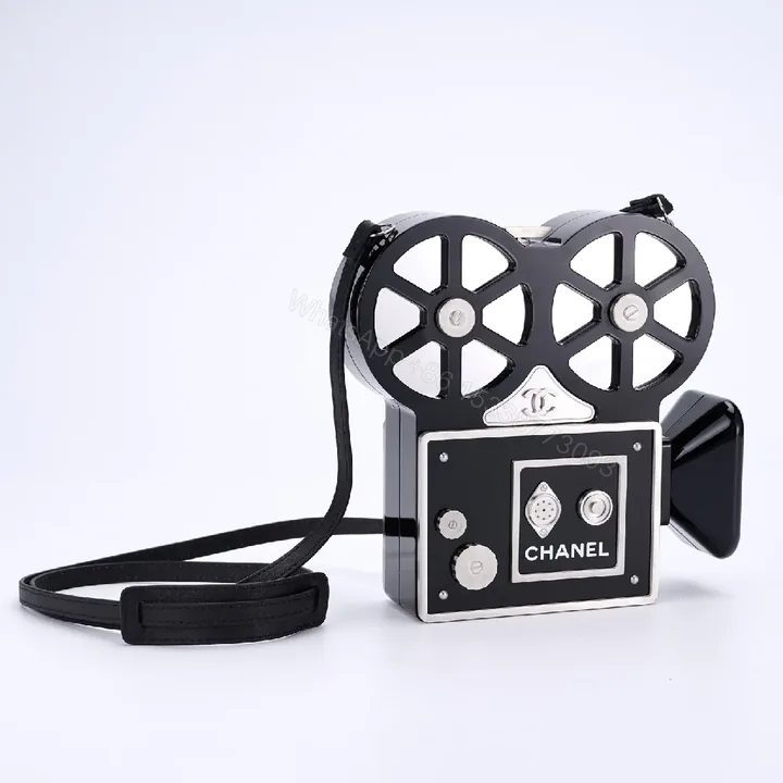View 1 of Compact Reel-Clutch: Lux Gloss Hardware with Architectural Silhouette