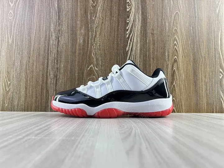 View 1 of Black & White Contrast Runner with Bold Red Sole Sneakers