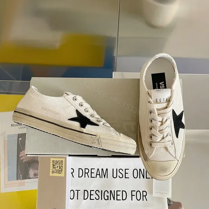 View 1 of Chic Canvas Star Sneakers - Signature Detail, Unisex