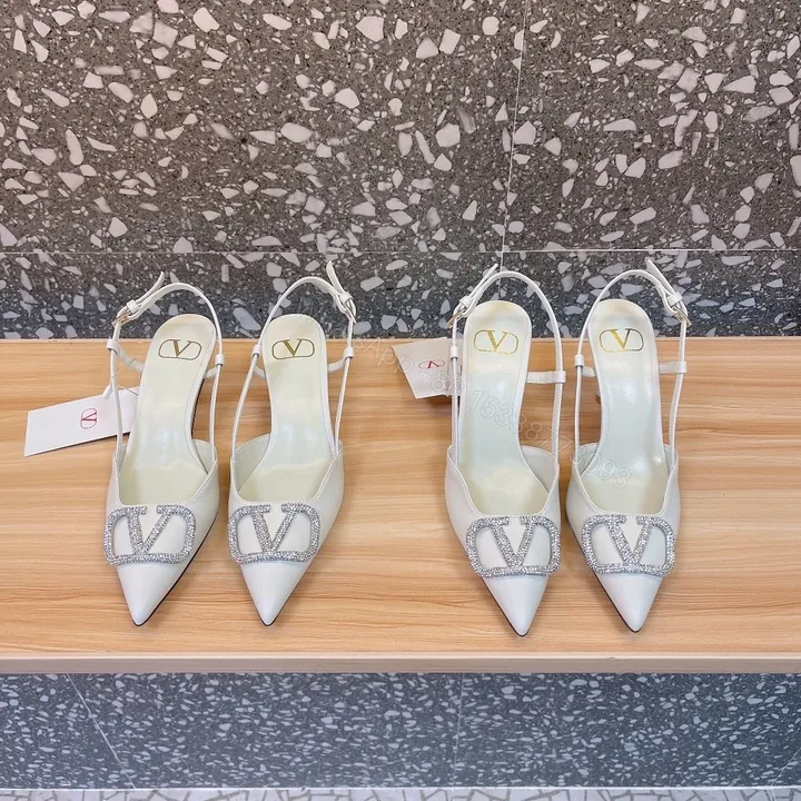 View 1 of Valentino Women White Leather Pointed Slingback Pumps