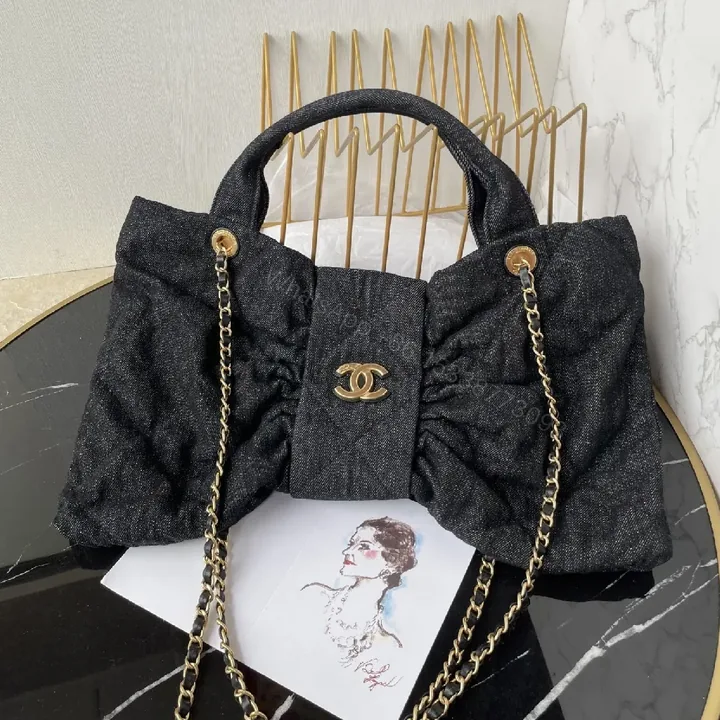 View 1 of Chic Denim Quilt Bag with Gold Hardware