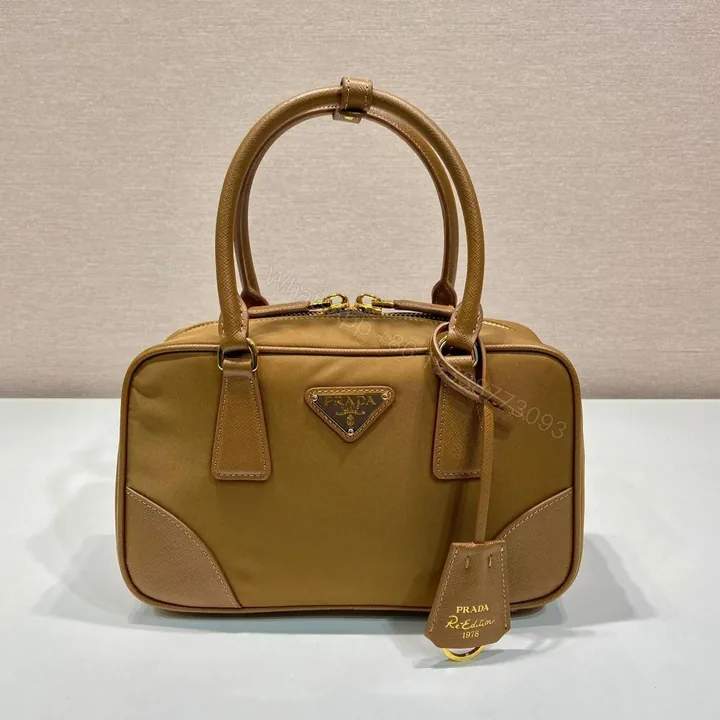 View 1 of SMALL TOP HANDLE BAG 25 IN GOLDEN BROWN NYLON AND CALFSKIN TRIM