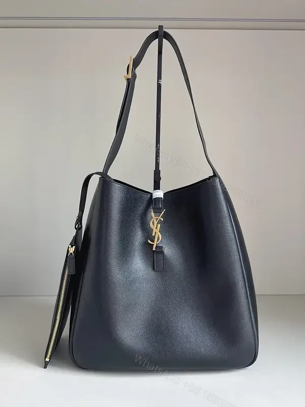 View 1 of Navy Leather Bucket Bag with Gold YSL Charm and Zippered Pocket