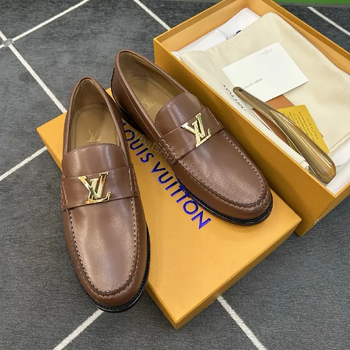 View 1 of Brown Leather Loafers with Gold Emblem: Luxury Everyday Comfort