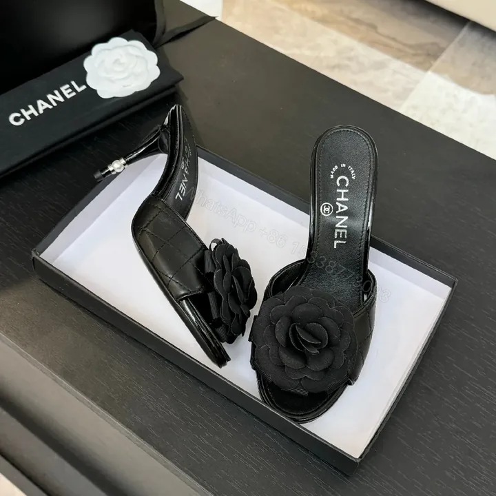 View 1 of Floral-Accent Black Leather Mules—Couture-Inspired Comfort