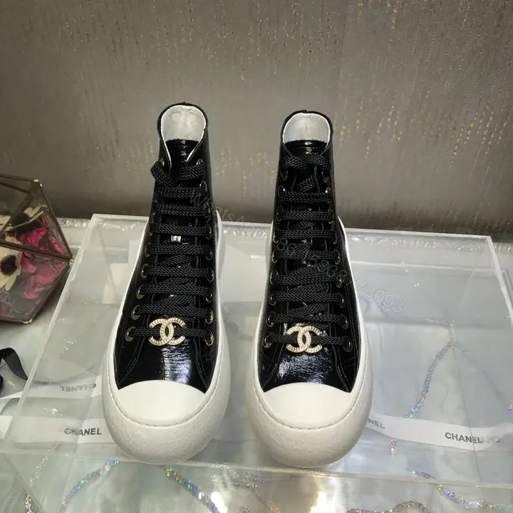 View 1 of Chanel-Inspired Black Patent High-Top Sneakers with Gold Logo