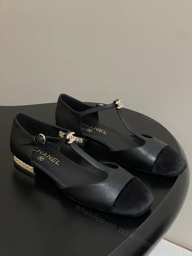 View 1 of Black Leather Velvet Toe Mary Jane Pumps with Pearl Accent Details