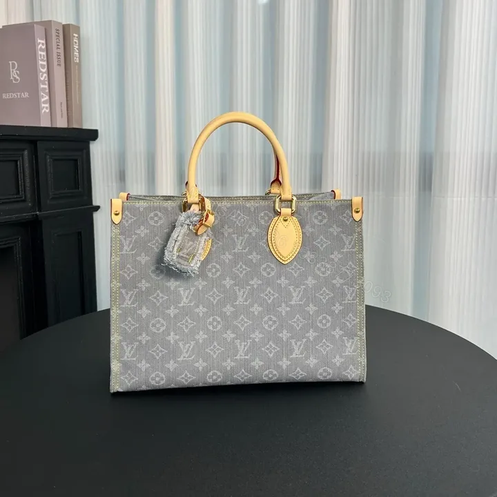 View 1 of Louis Vuitton OnTheGo MM Monogram Denim canvas