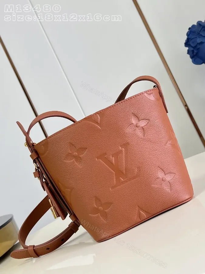 View 1 of Soft-Tone Cropped Bucket Bag with Monogram Embossing Bag