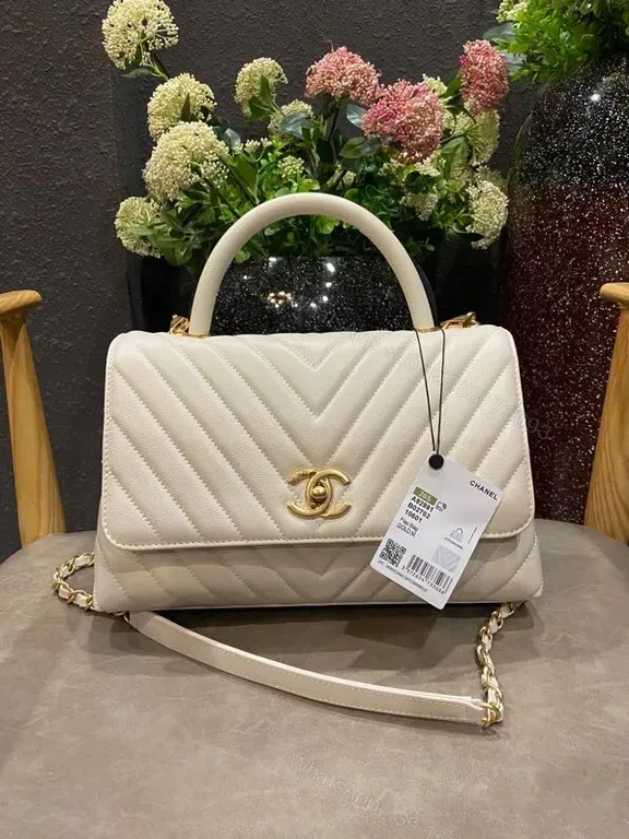 View 1 of White Quilted Luxury Bag with Gold Logo â€“ Chic Everyday Elegance
