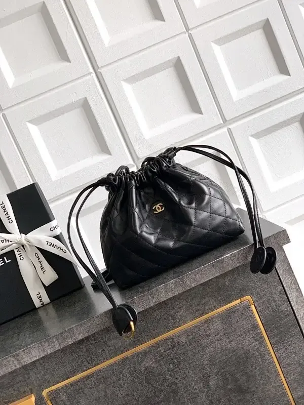 View 1 of Quilted Drawstring Bag - Black Leather-Feel, Gold Accent