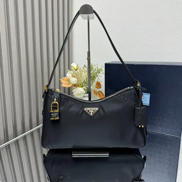 View 1 of Chic Black Nylon Prada-Influenced Shoulder Bag with Gold Hardware