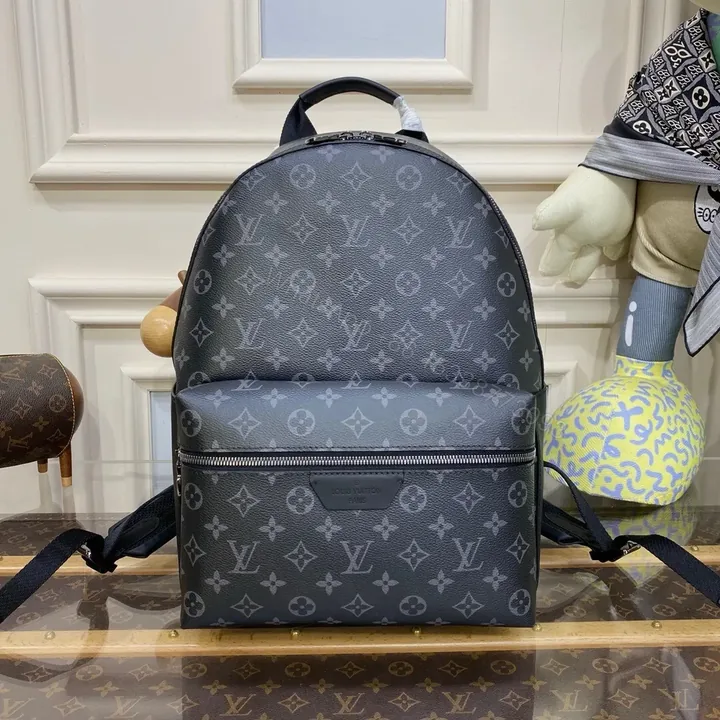 View 1 of Louis Vuitton Discovery Backpack in Monogram Eclipse canvas