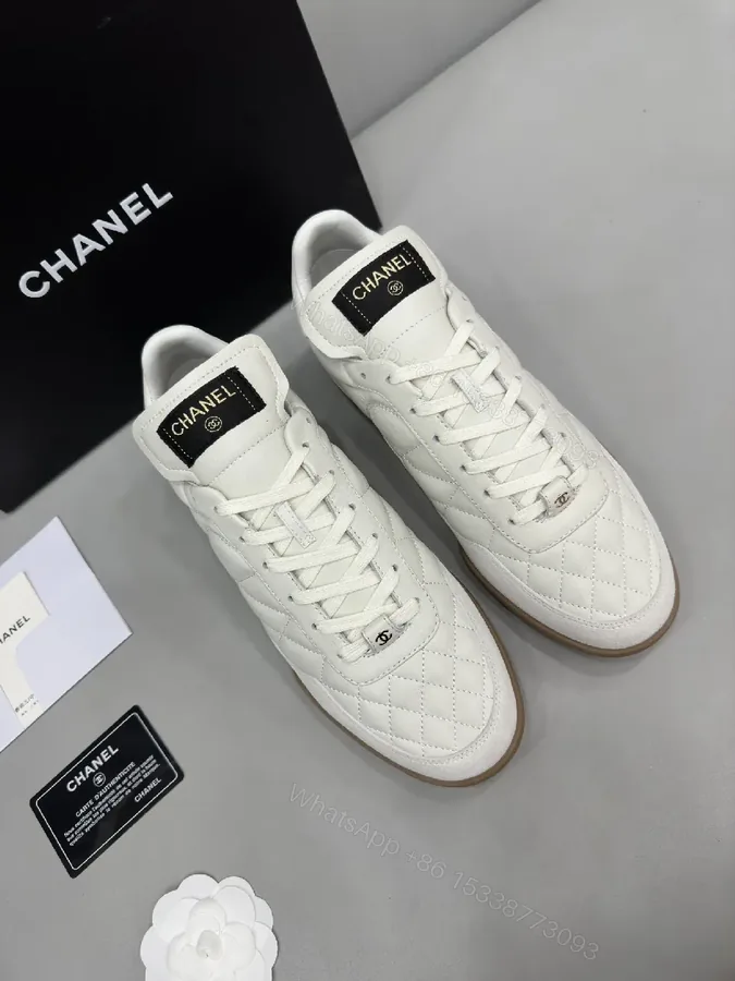 View 1 of White Quilted High-Top Leather Sneakers with Signature Details