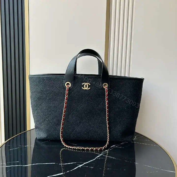 View 1 of Chic Black Quilted Tote with Gold Hardware - Luxury Everyday tote