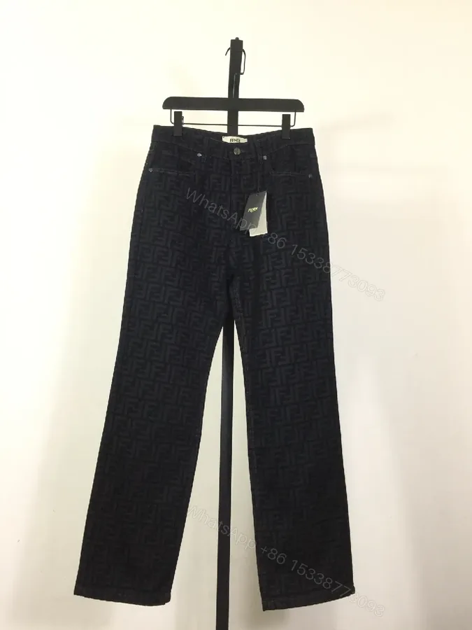 View 1 of Monogram Denim Trousers - Structured Texture, Modern Versatility
