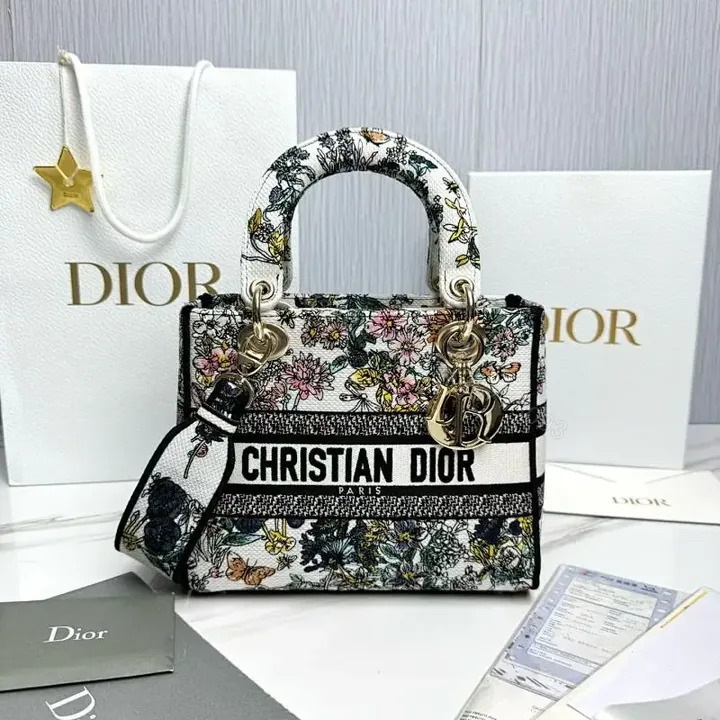 View 1 of Floral Canvas Luxe Bag with Logo Detailing Handbag