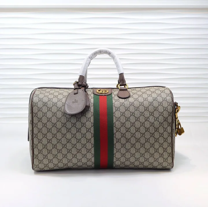 View 1 of Gucci Ophidia GG Medium Duffel Bag – size 44 x 27 x 24 cm