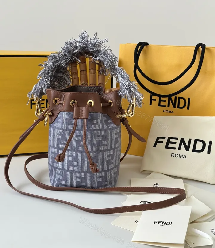 View 1 of Chic Canvas Bucket Bag with Leather Trim & Fringe Detail