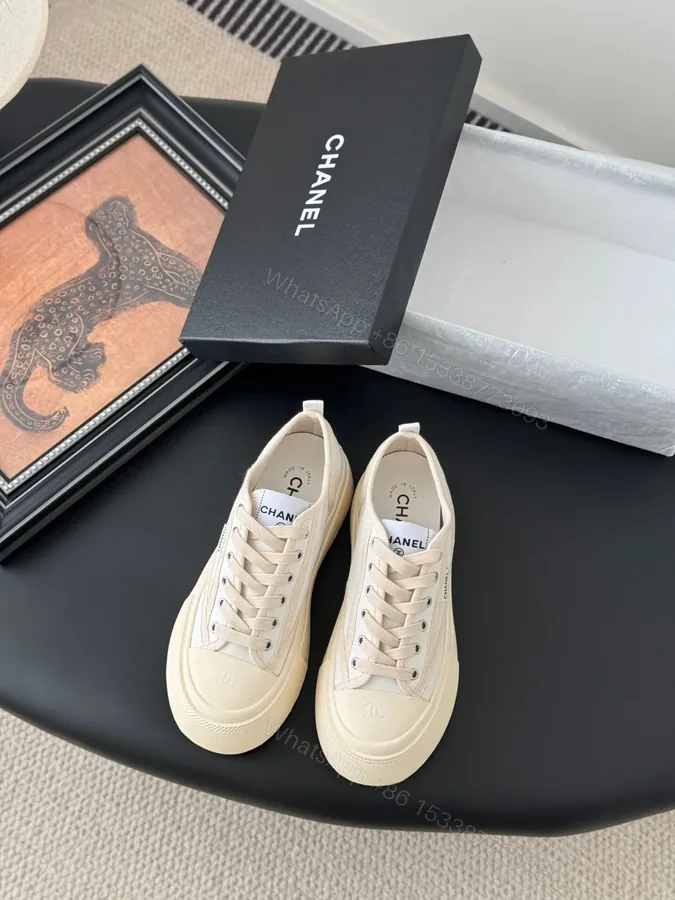 View 1 of Chanel Women Beige Canvas And Rubber Sneakers