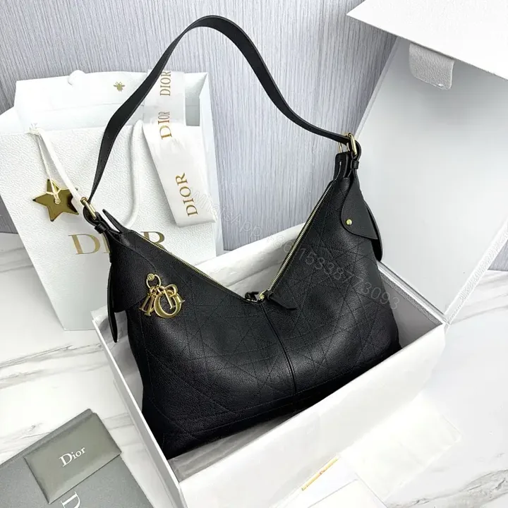 View 1 of Chic Black Leather Hobo with Gold Accents — Luxury Everyday Bag