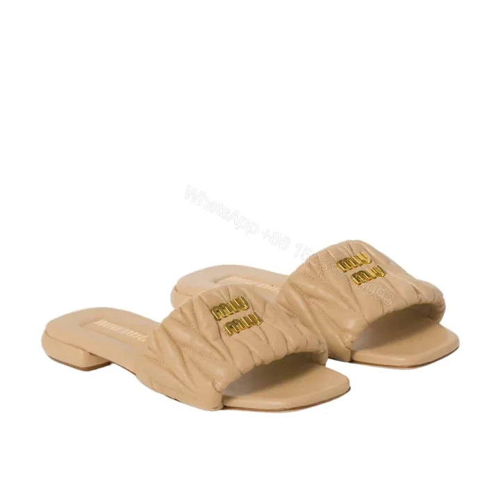 View 1 of MIUMIU MATELASSÉ NAPPA LEATHER SLIDES SAND BEIGE 5XX605 88T F0036 F 010